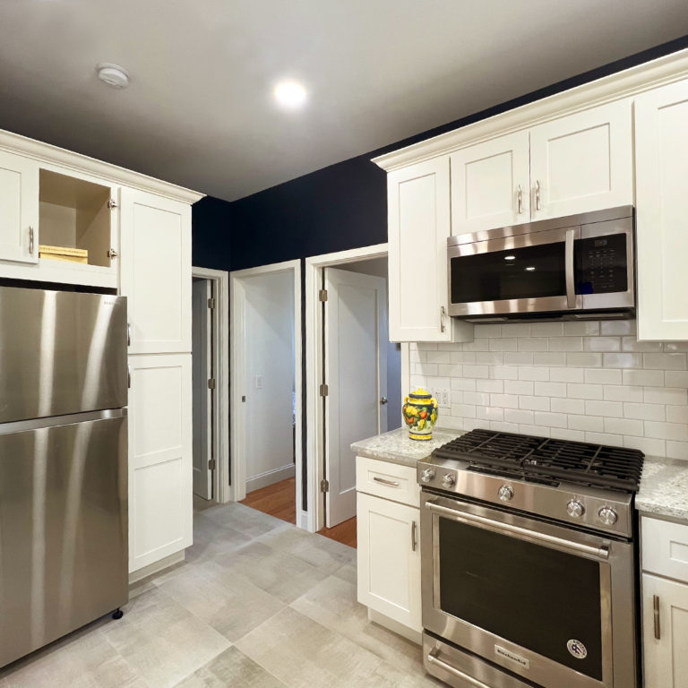 View of oven, fridge and rooms from kitchen