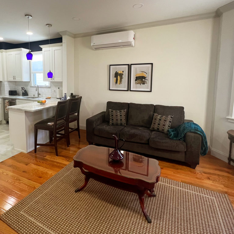 View of living room and kitchen from entrance